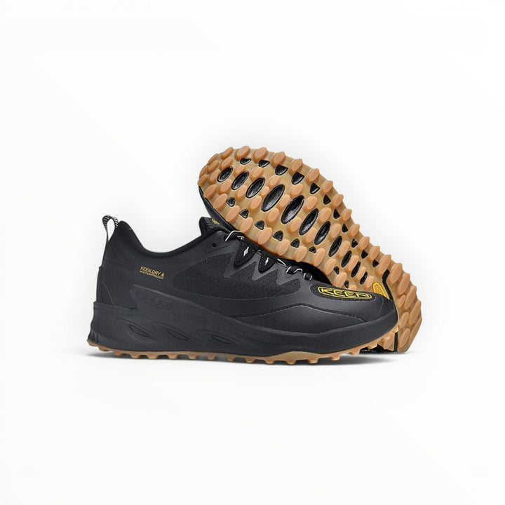 KEEN NXIS EVO WP women's waterproof hiking shoe in Black/Gum, three-quarter and outsole view