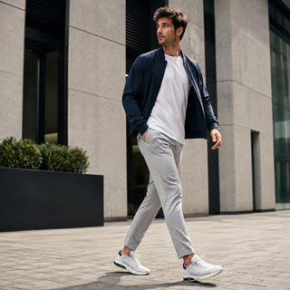 Man wearing versatile lifestyle sneakers in a modern city