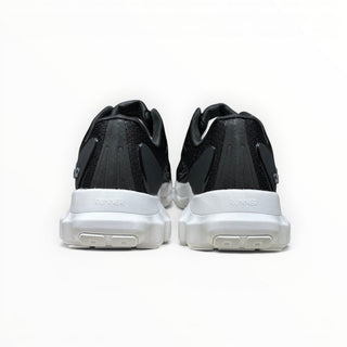 FWSports Shoes Alo Yoga Alo Runner black and white lightweight sneakers, rear view showing cushioned white midsoles.
