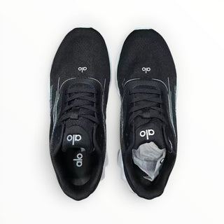 FWSports Shoes Alo Yoga Alo Runner black and white lightweight low-top sneakers with breathable mesh and lace-up closure.