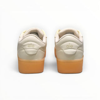 FWSports Shoes Alo Yoga Recovery Mode low-top sneakers in beige with a gum rubber sole, rear view.