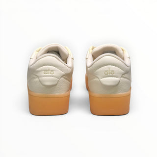 FWSports Shoes Alo Yoga Recovery Mode low-top sneakers in beige with a gum rubber sole, rear view.