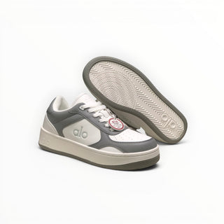 FWSports Shoes Alo Yoga Recovery Mode low-top sneakers in grey and white with a cushioned sole and rubber outsole.
