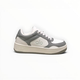 FWSports Shoes Alo Yoga Recovery Mode low-top sneakers in grey and white with a cushioned sole and lace-up closure.