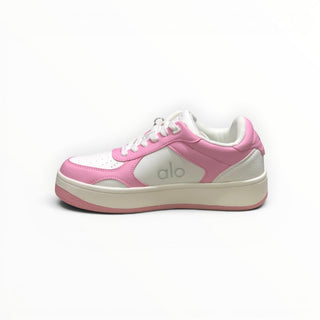 FWSports Shoes Alo Yoga Recovery Mode low-top sneakers in pink and white with a cushioned sole and lace-up design.