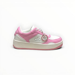 FWSports Shoes Alo Yoga Recovery Mode low-top sneakers in pink and white with a cushioned sole and lace-up design.