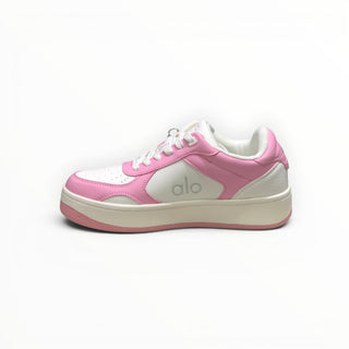 FWSports Shoes Alo Yoga Recovery Mode low-top sneakers in pink and white with a cushioned midsole and lace-up design.