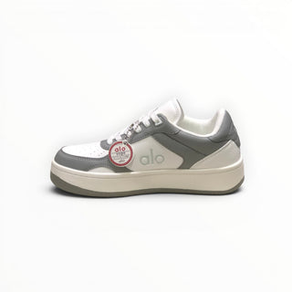FWSports Shoes Alo Yoga Recovery Mode low-top sneakers in grey and white with a cushioned sole and lace-up design.