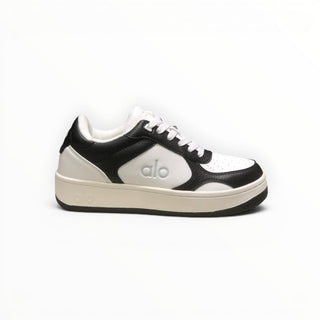 FWSports Shoes Alo Yoga Recovery Mode low-top sneakers in black and white with a cushioned sole and lace-up design.