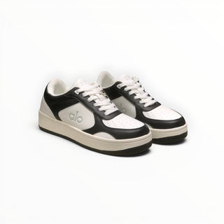 FWSports Shoes Alo Yoga Recovery Mode low-top sneakers in black and white with a cushioned sole and lace-up design.