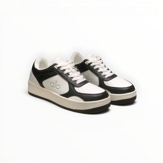 FWSports Shoes Alo Yoga Recovery Mode low-top sneakers in black and white with a cushioned sole and lace-up design.