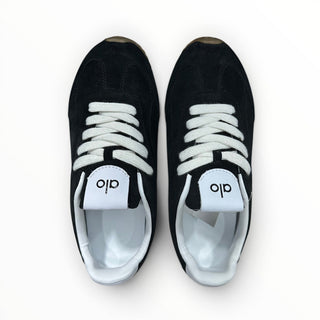 FWSports Shoes Alo Yoga Sunset black low-top lifestyle sneakers with white laces and cushioned interior, top view.