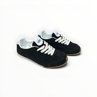 FWSports Shoes Alo Yoga Sunset black low-top lifestyle sneakers with white laces and a gum rubber outsole.