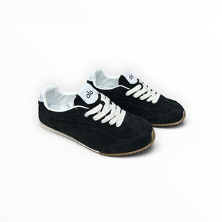 FWSports Shoes Alo Yoga Sunset black low-top lifestyle sneakers with white laces and a gum rubber outsole.
