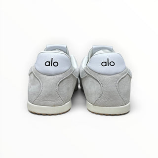 FWSports Shoes Alo Yoga Sunset grey low-top sneakers viewed from the back showing heel branding and rubber outsoles.