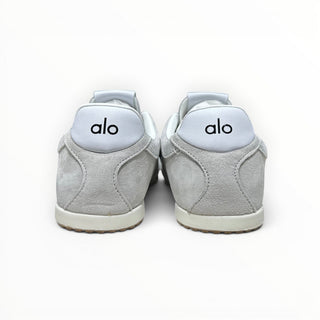 FWSports Shoes Alo Yoga Sunset grey low-top sneakers featuring a cushioned heel with logo branding, rear view.