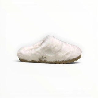 FWSports Shoes Alo Yoga white faux fur recovery slipper with a plush upper and a textured tan sole.