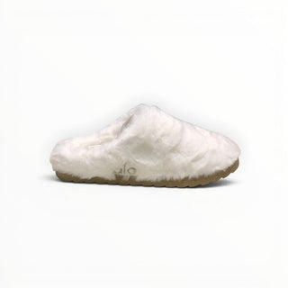 FWSports Shoes Alo Yoga white faux fur recovery slipper with a plush upper and a textured tan sole for indoor comfort.