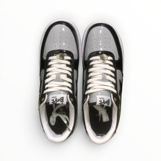 FWSports Shoes BAPE STA low-top sneakers in black and grey patent leather with white laces and silver lace charms.