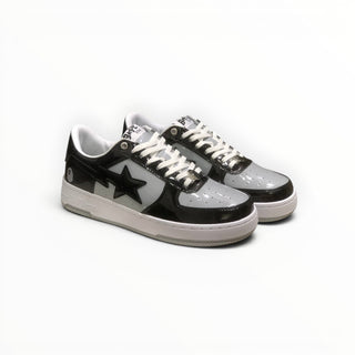 FWSports Shoes BAPE STA low-top sneakers in black and white patent leather with signature star side panel design.