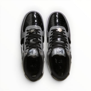 FWSports Shoes BAPE STA low-top sneakers in grey and black patent leather with lace-up closure and cushioned interior.