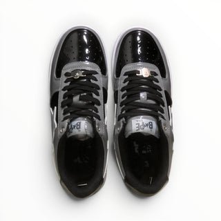 FWSports Shoes BAPE STA low-top sneakers in grey and black patent leather with lace-up closure and cushioned interior.
