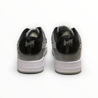 FWSports Shoes BAPE STA low-top sneakers in grey and black, featuring a rear view with branded heel tabs.