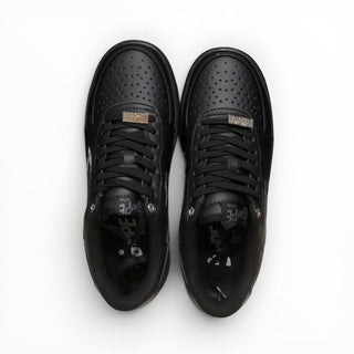 FWSports Shoes BAPE STA triple black low-top sneakers with perforated toe box and lace-up closure.