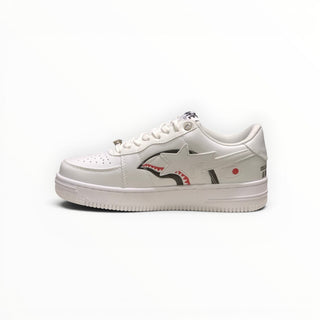 FWSports Shoes BAPE STA low-top sneakers in triple white with shark graphic side detail and lace-up closure.