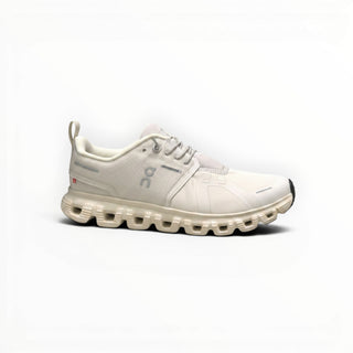 FWSports Shoes On Cloud 6 waterproof sneakers in beige with a two-tone mesh upper and cushioned rubber lug sole.