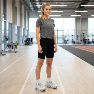FWSports Shoes woman wearing brown On-Run Cloudtilt sneakers with mesh upper and Helion superfoam in a gym setting