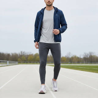 FWSports Shoes model wearing brown On Running Cloudmonster sneakers with athletic gear on a running track