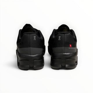 FWSports Shoes Cloudmonster women's black running shoes, rear view showing oversized CloudTec cushioning and heel detail.