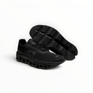 FWSports Shoes Cloudmonster women's black running shoes with oversized CloudTec cushioning and breathable mesh upper.