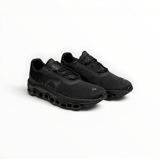 FWSports Shoes Cloudmonster women's black running shoes with breathable mesh upper and oversized CloudTec cushioning.