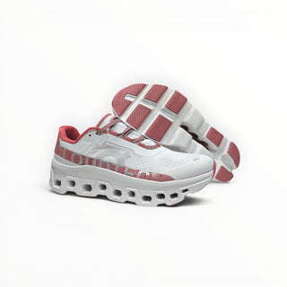 FWSports Shoes On Cloudmonster women's running shoes in gem red and white with oversized CloudTec cushioning.
