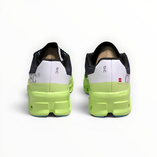 FWSports Shoes On Cloudmonster women's running shoes in iron black and neon green, rear view showing heel cushioning.