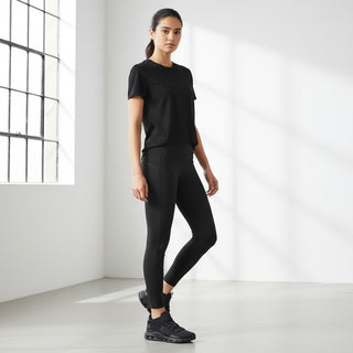 FWSports Shoes CLOUDNOVA women's black running shoes with sock-like upper and CloudTec cushioning worn by a model