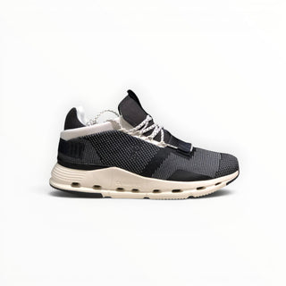 FWSports Shoes Cloudnova women's running sneaker in white, grey, and black with a breathable sock-like upper.