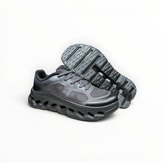 FWSports Shoes On Cloudtilt Remix women's running sneaker in blackout and charcoal with layered x-ray mesh upper.