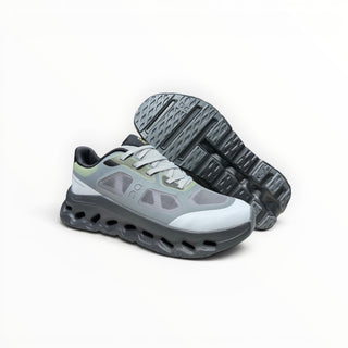 FWSports Shoes On Cloudtilt Remix women's running sneakers in grey, black, and lime with a layered x-ray mesh upper.