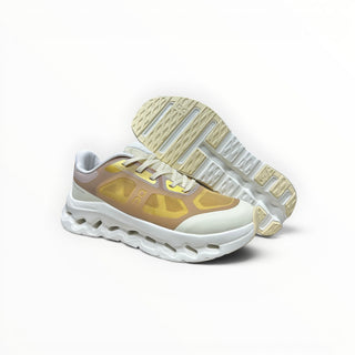 FWSports Shoes On Cloudtilt Remix men's running sneaker in honey, gold, and white with a layered x-ray mesh upper.