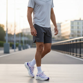 FWSports Shoes On Cloudtilt Remix sneakers in pink and lavender with CloudTec Phase sole worn by a man outdoors