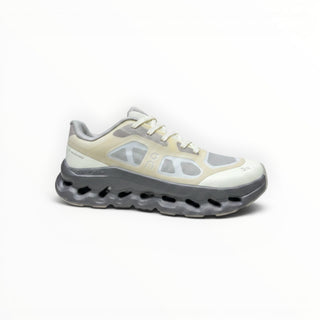 FWSports Shoes On Cloudtilt Remix men's running sneaker in cream, sand, and charcoal with layered x-ray upper design.