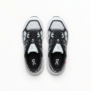 FWSports Shoes On Cloudtilt Remix men's running sneakers in black and white with layered x-ray mesh upper, top view.