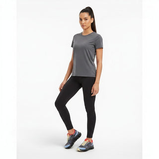 FWSports Shoes On Cloudtilt Remix sneakers in dark mocha, slate blue, and red worn by a woman in athletic wear.