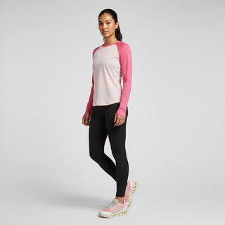 FWSports Shoes model wearing a pink and cream long-sleeve shirt, black leggings, and On Cloudtilt Remix sneakers.