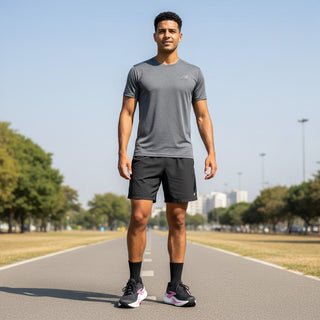 FWSports Shoes Glycerin Max 2 black running shoes on a male runner wearing athletic gear on a paved path