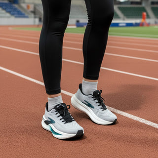 FWSports Shoes Glycerin Max 2 grey running shoes with plush cushioning and GlideRoll rocker on a track