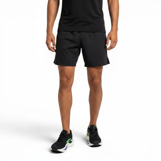 FWSports Shoes Glycerin Max 2 running shoes in black and green worn by a man in black athletic shorts